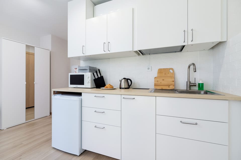 The fully equipped kitchenette includes everything you need for a home-cooked meal.