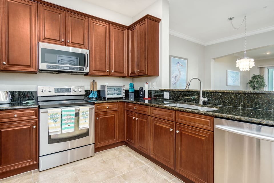 Open Kitchen Concept With Granite Counters And Stainless Appliances! 
Brew up your morning coffee in the drip coffee maker or the Keurig