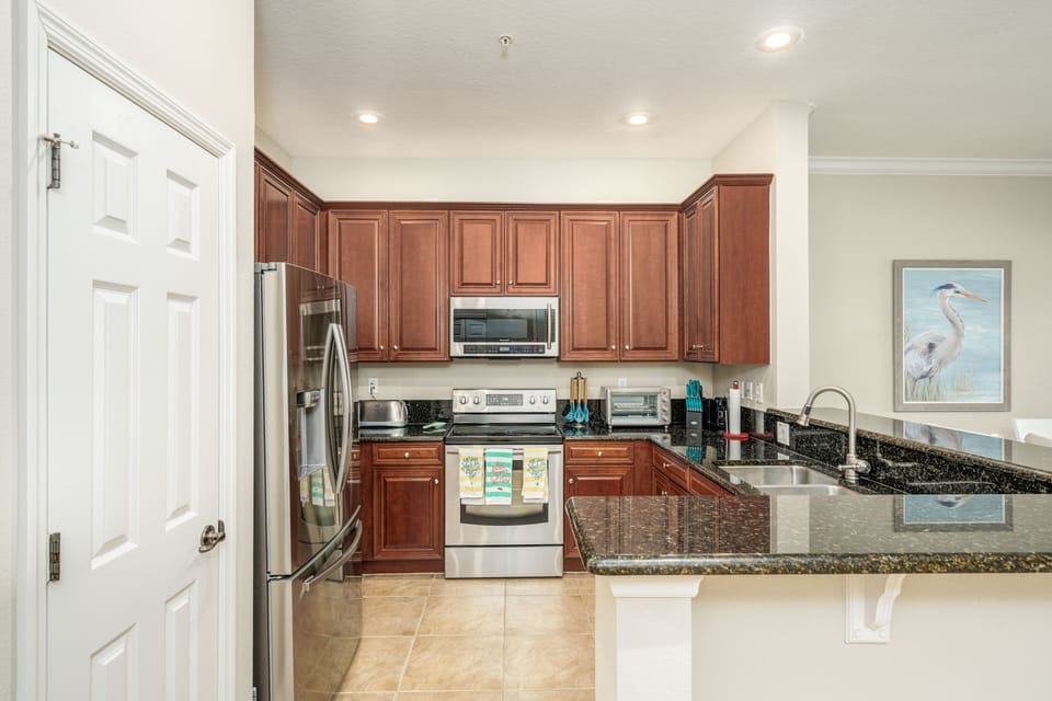 Kitchen opens up to the dining and living spaces.