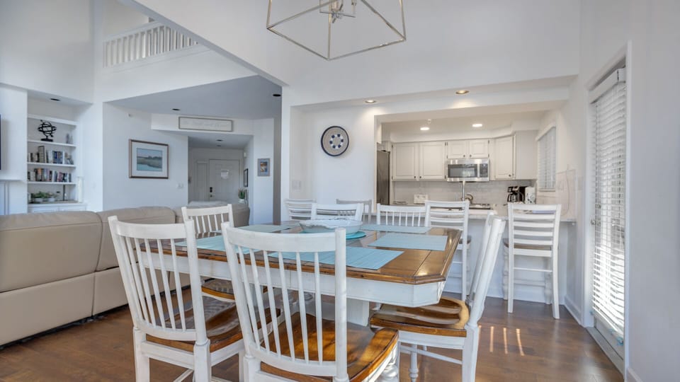 Positioned just off the living area, this space flows effortlessly for everyday meals or relaxed entertaining, all set against a bright coastal backdrop.