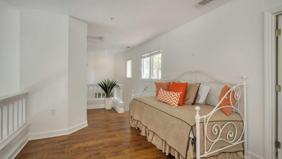 Neutral finishes with cheerful coastal accents create a relaxed retreat—perfect for kids, teens, or extra guests who appreciate their own comfortable hideaway.