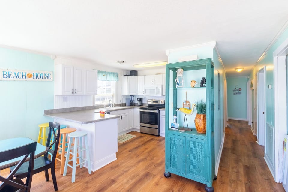Kitchen and Hall - The bright colors and open layout make Summer place a dream haven.