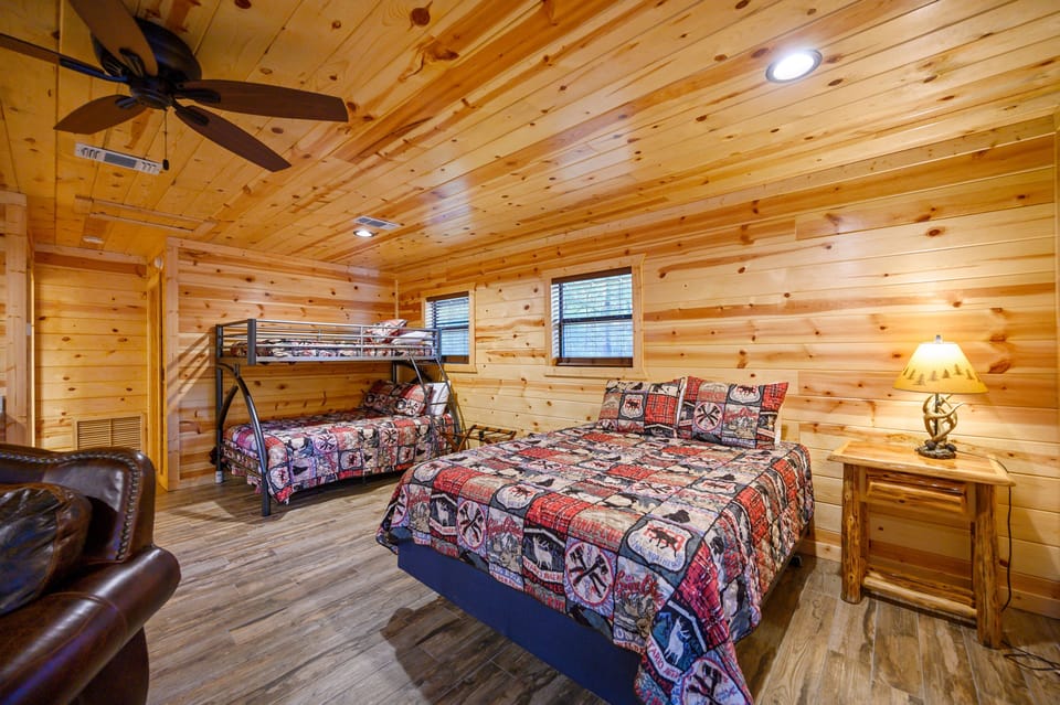 Dog House has a queen bed and twin over  full bunk bed. 
