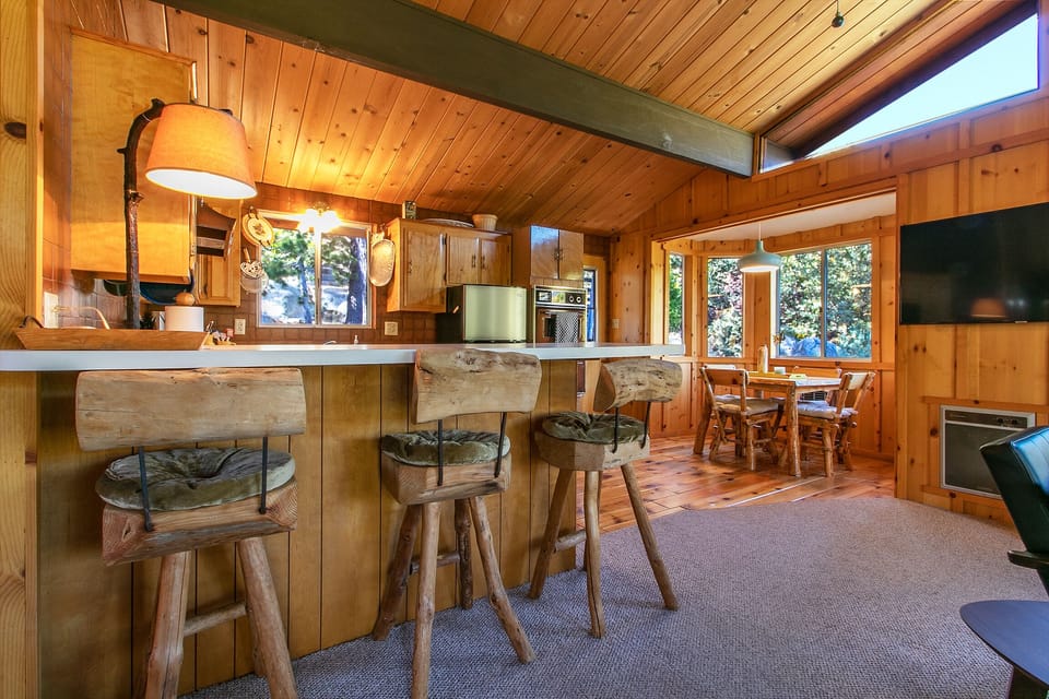 Kitchen Bar seating for 3 or enjoy your meals at the rustic table for 4.