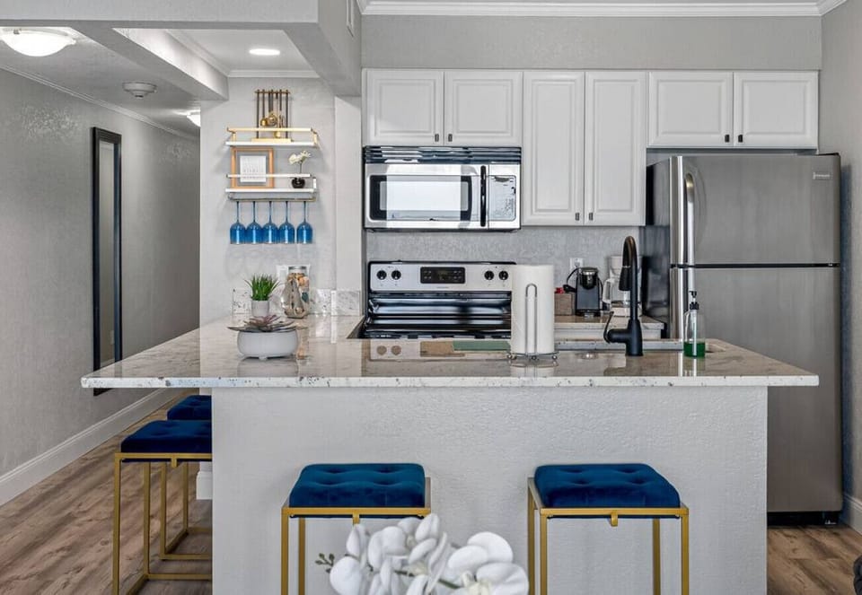 The kitchen features a spacious cabinet that allows for excellent food storage