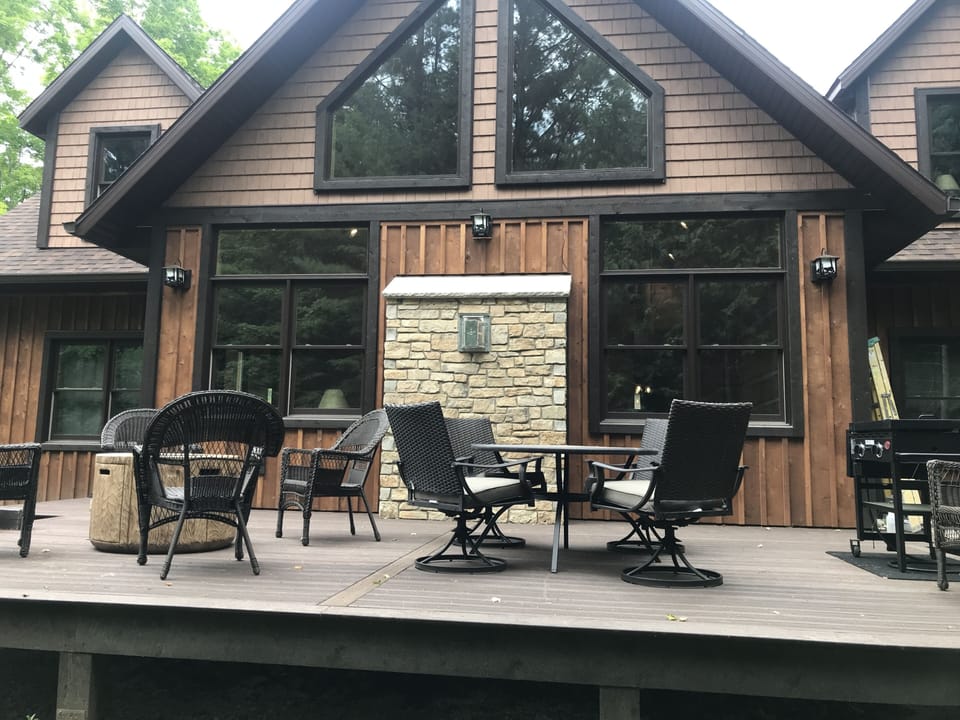 Back of home privacy with large deck and woods. Door County stone
