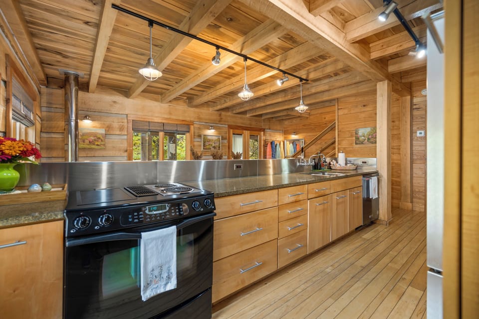 Galley kitchen with stainless & granite counters, Craft-maid maple cabinetry.