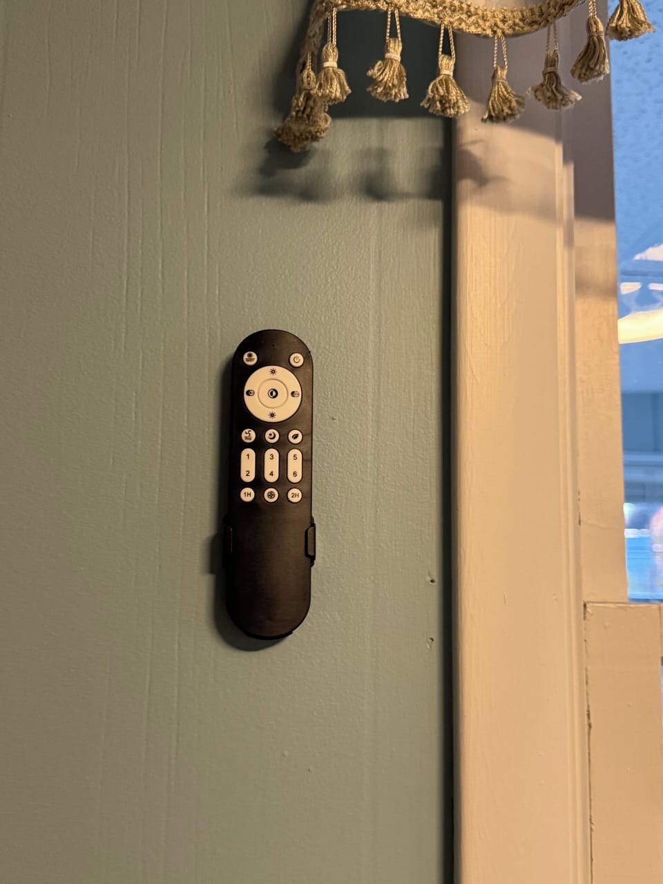 Upper level- Ceiling fan remote- Located on kitchen wall.