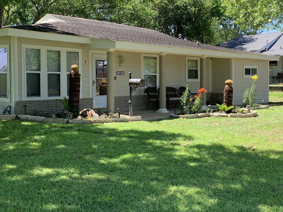 Exterior with seating area and nice landscaping 