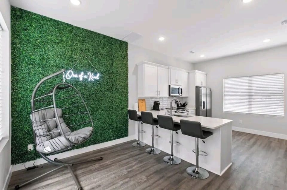FULL KITCHEN WITH SWINGCHAIR AND BAR SEATING VIEW