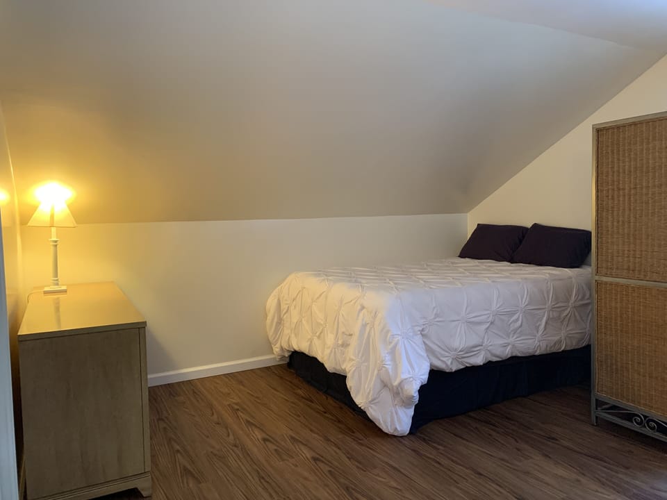 2nd Fl bedroom w/ 2 Queen beds, window AC, TV & DVD