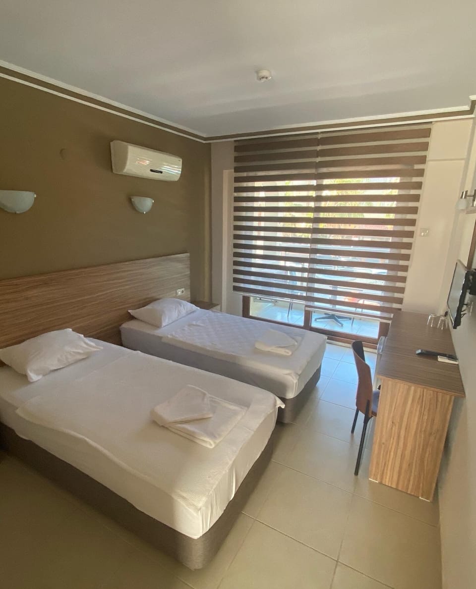 Economy Double or Twin Room | Minibar, desk, laptop workspace, WiFi