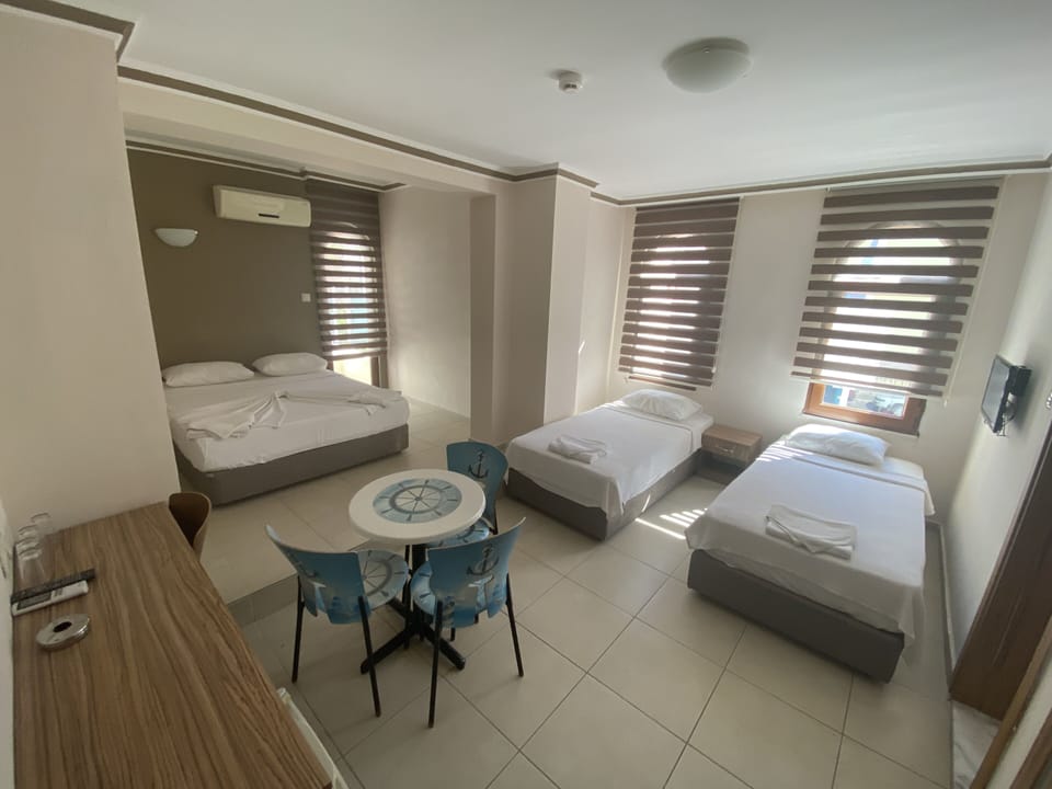 Family Room | Minibar, desk, laptop workspace, WiFi