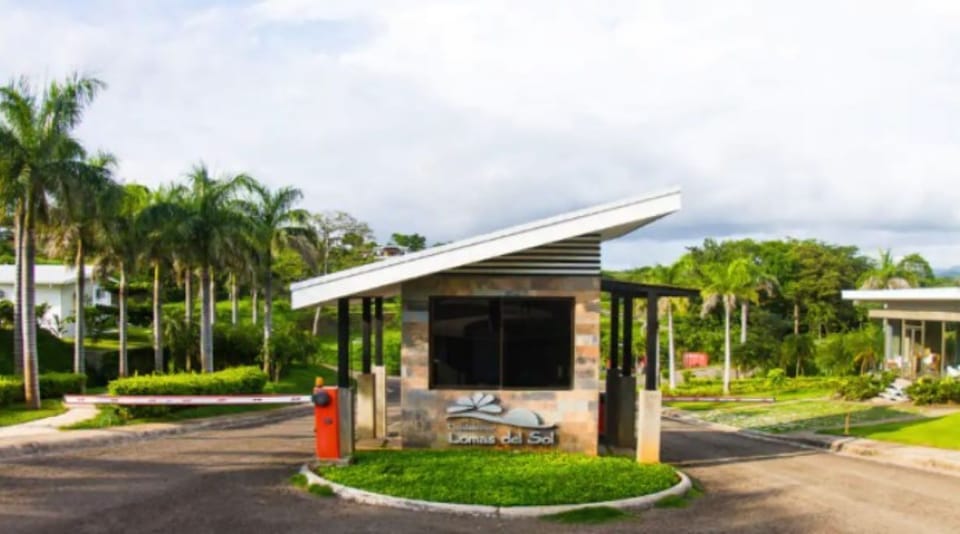 View of Condominio Lomas del Sol entrance and guard station.