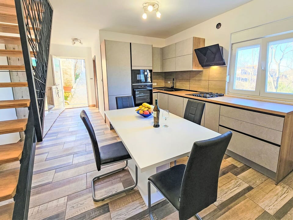 Furniture, Flooring, Interior Design, Floor, Countertop, Wood, Kitchen, Wood Flooring, Kitchen & Dining Room Table, Lighting