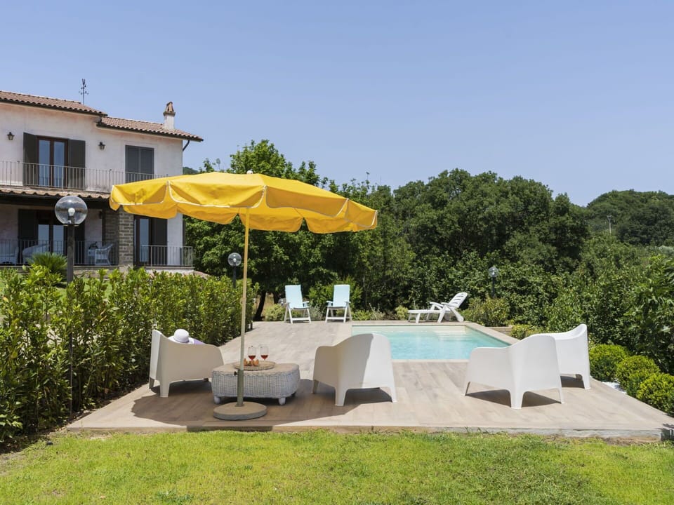 Plant, Sky, Umbrella, Window, Shade, Chair, Outdoor Furniture, Tree, Table, Leisure