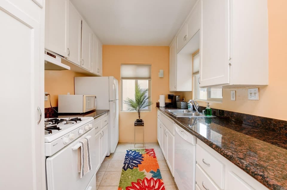 Kitchen - Fully stocked with stove, refrigerator, microwave, fridge, toaster, Keurig coffee maker, dishes, pots and pans, etc.