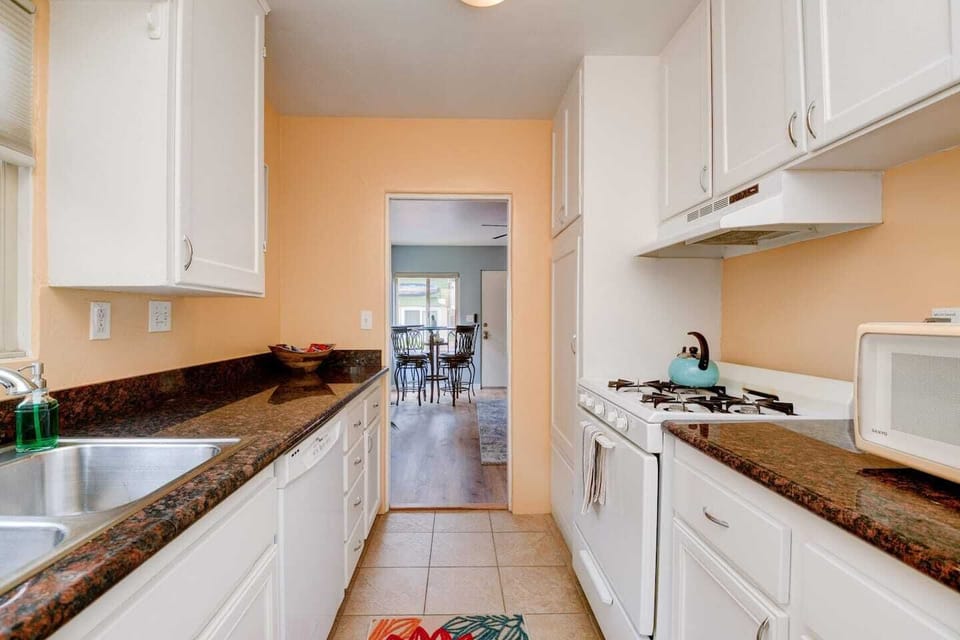 Kitchen - Fully stocked with stove, refrigerator, microwave, fridge, toaster, Keurig coffee maker, dishes, pots and pans, etc.
