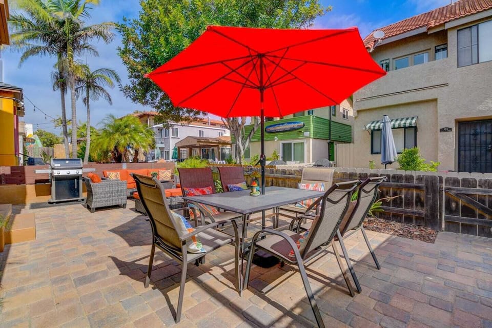 Front Patio - shared front patio features 2 BBQ's (propane), outdoor dining table with umbrella, outdoor sofa and chairs with fire table (propane) 