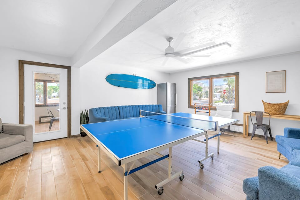Spacious game room with ping pong table.