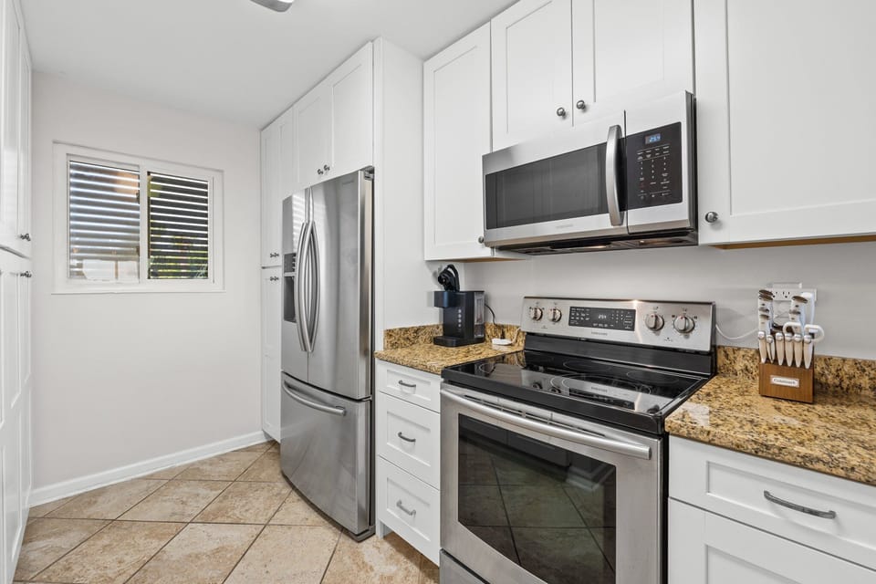 Whether you're whipping up a seafood feast or enjoying takeout with a sunset backdrop, this kitchen keeps you close to the heart of the home
