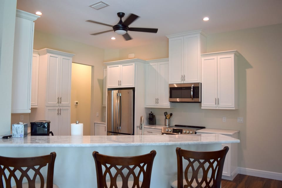 Updated Kitchen with MARBLE counter tops & stainless steel appliances.