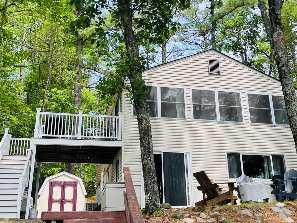 View of house from the lake with new deck