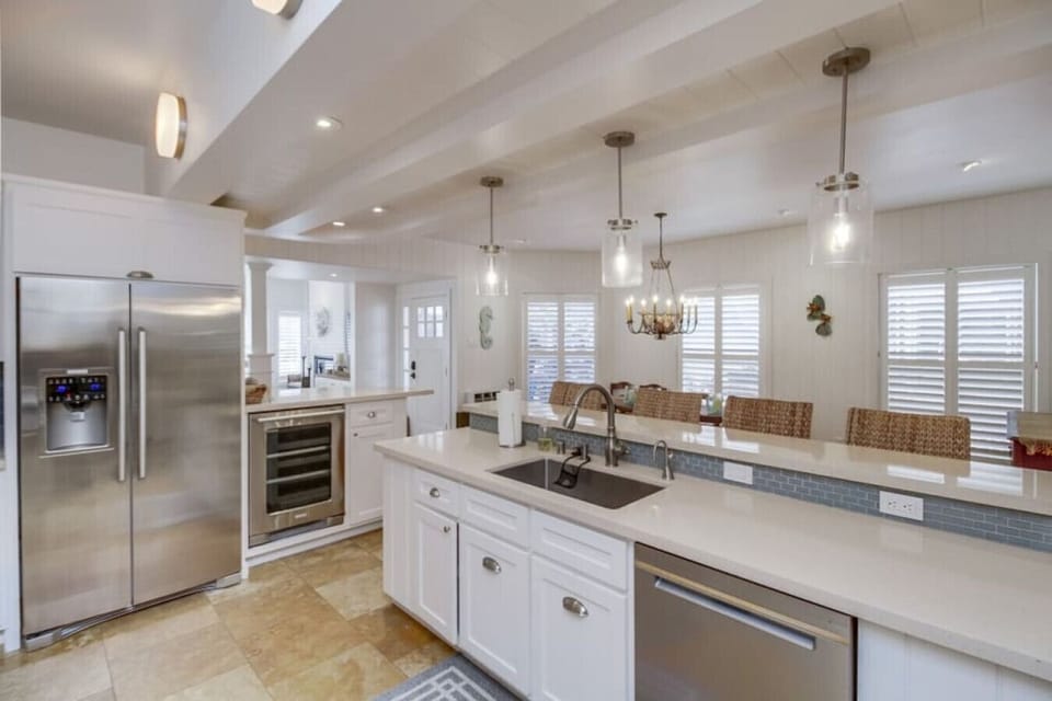 This kitchen is fully prepped with everything you need to make a dinner at home. With a large fridge and wine fridge inside plus an additional garage fridge we are sure you will have enough space to fit all the groceries you need!
