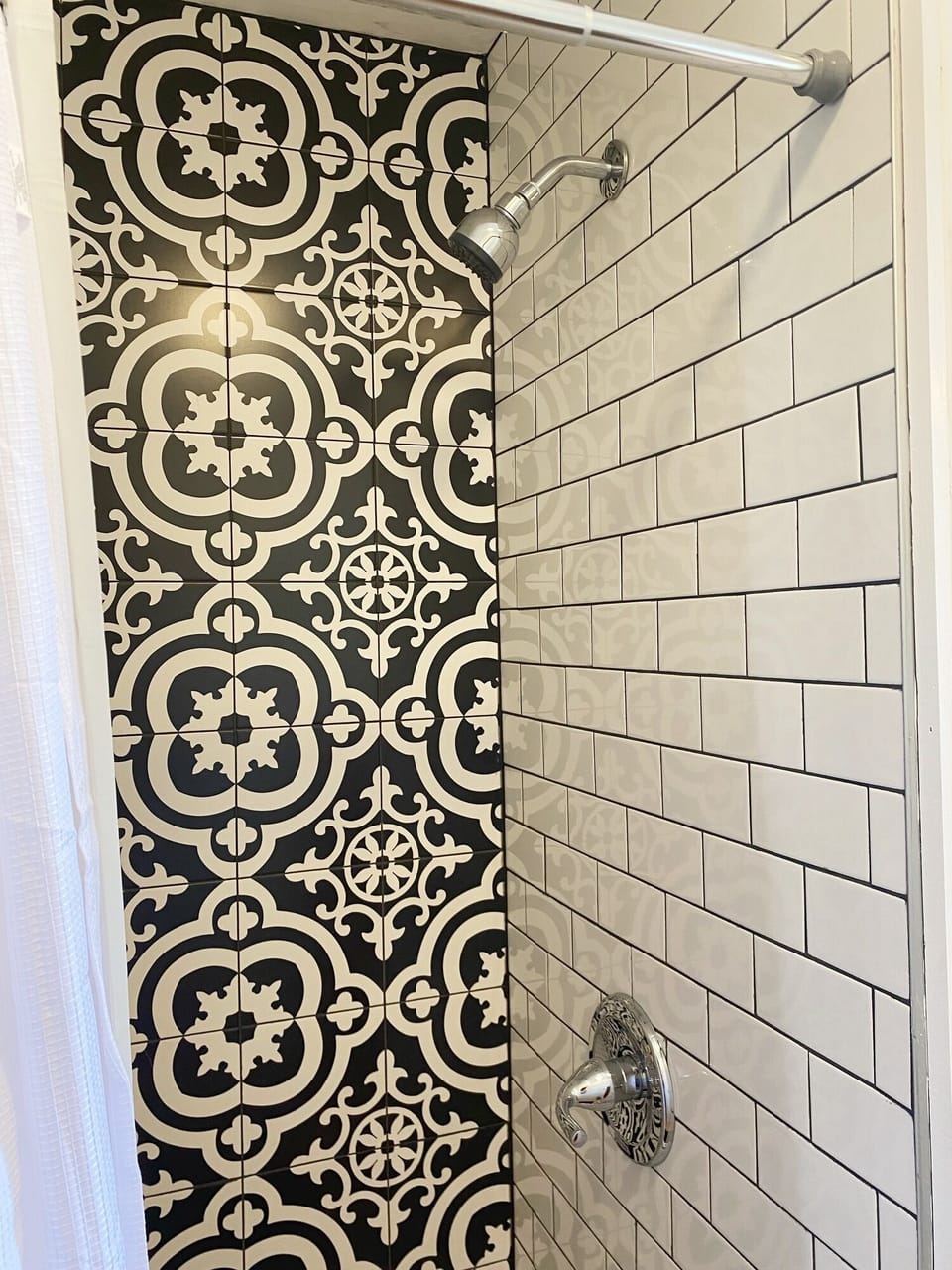 Shower among the walls of the visually pleasing tile shower.