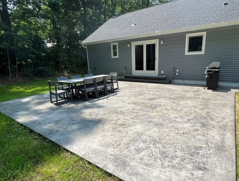 Stamped concrete patio with seating for 8 + gas BBQ