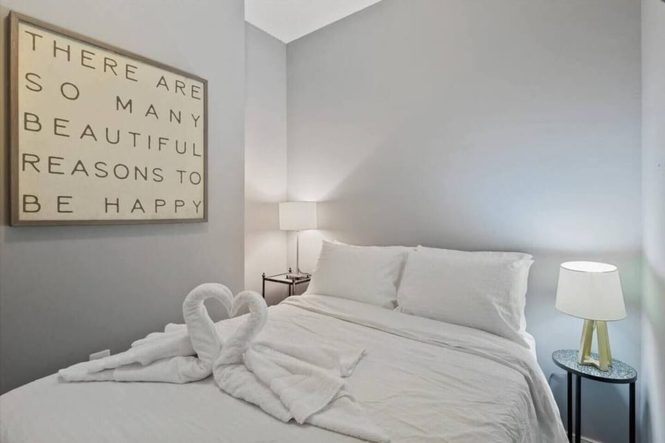 Charming bedroom with elegant furnishings and ample lighting, ensuring a peaceful retreat.
