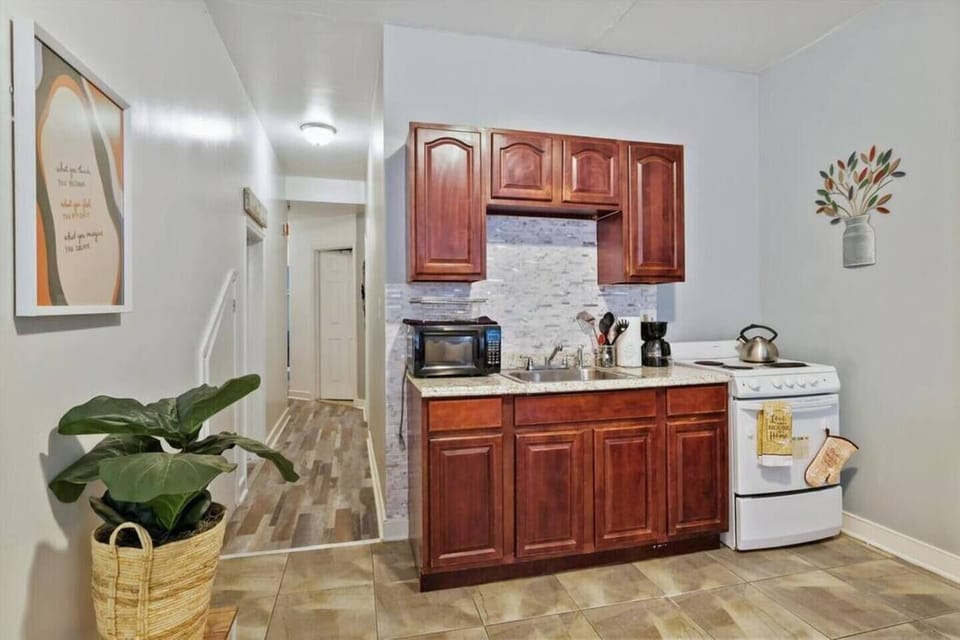 Fully stocked kitchen with all cookware, dishwasher, silverware, microwave, toaster, oven stove and fridge. 