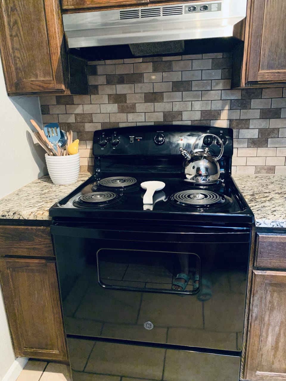 Brand new stove. Pots, pans, and baking sheets in this fully stocked kitchen. 