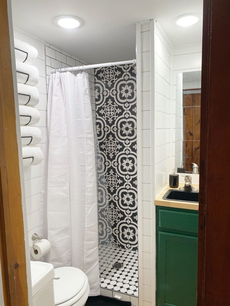 The bathroom is small but visually, packs a big punch!