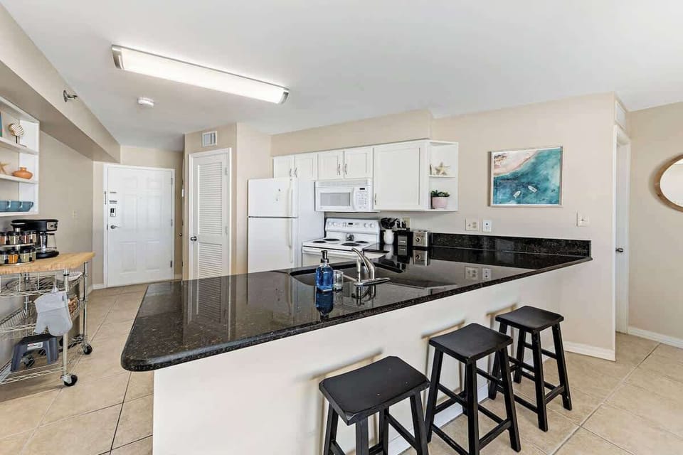 {KITCHEN} - Fully equipped kitchen with spices, cookware and ice maker. Plus coffee bar with coffee, creamer and sugar. 