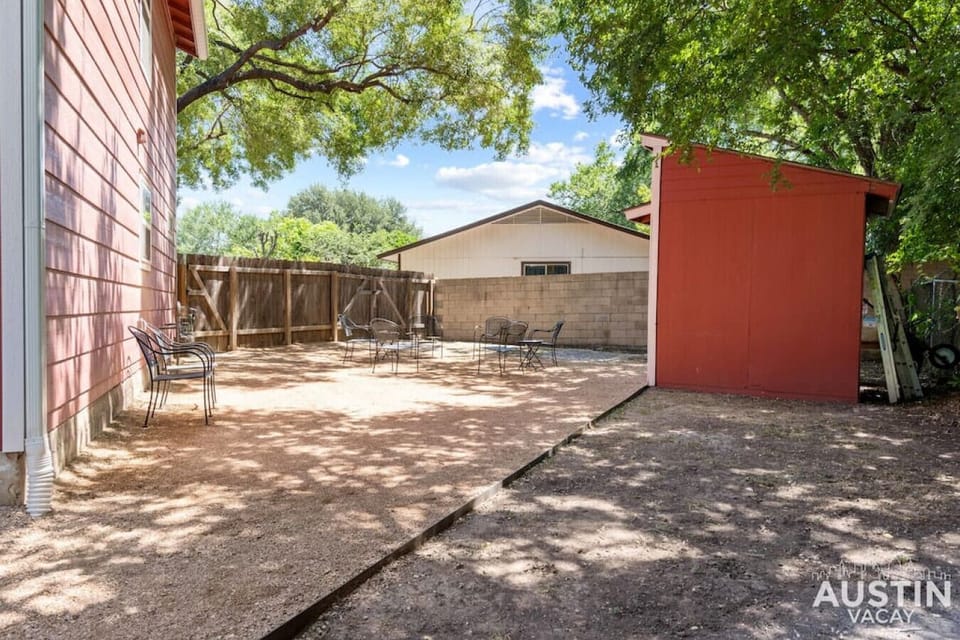 Shared fenced in backyard with conversational seating