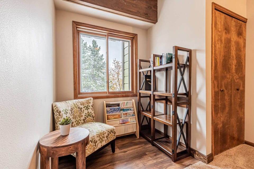 Tucked away under the signature wood beams, this cozy nook is the ultimate mountain hideaway.