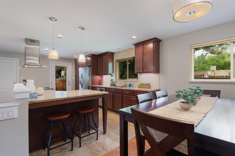 Experience the open concept design as the kitchen flows seamlessly into the dining area.