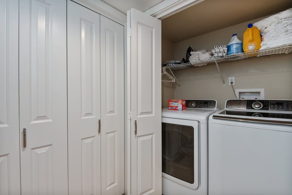 Effortlessly tackle laundry with the full-sized washer and dryer and provided supplies.
