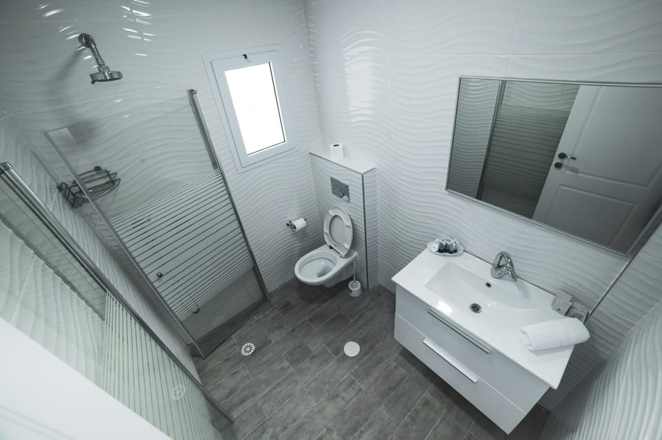 Premium Triple Room, Patio | Bathroom | Shower, towels
