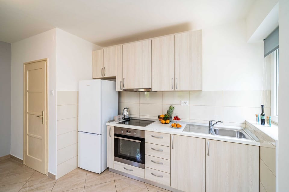 Apartment (Two Bedroom Apartment with Balcony) | Private kitchen | Fridge
