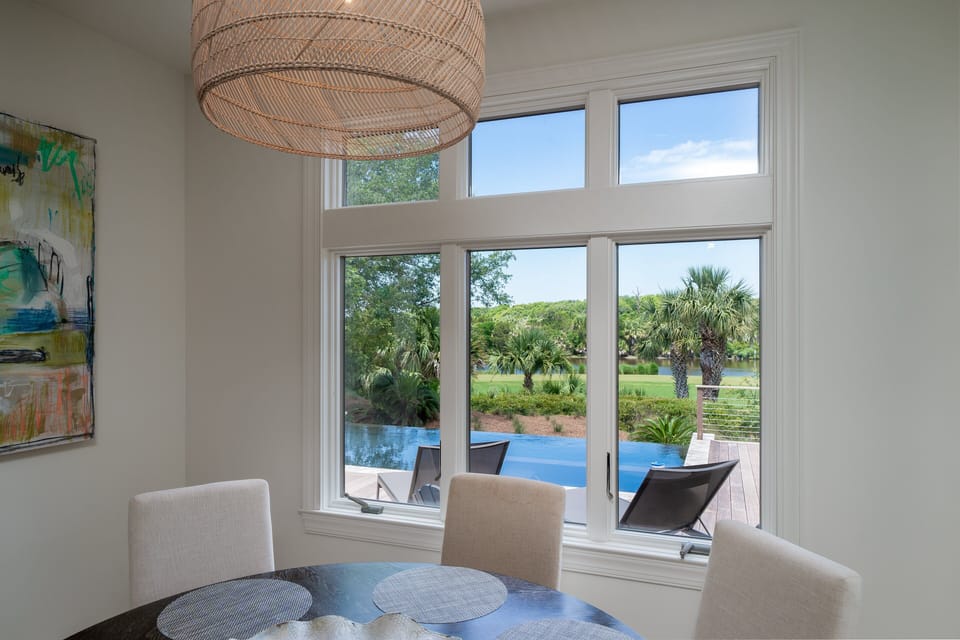 Beautiful pool views while you dine!  Round dining table comfortably seats 6.