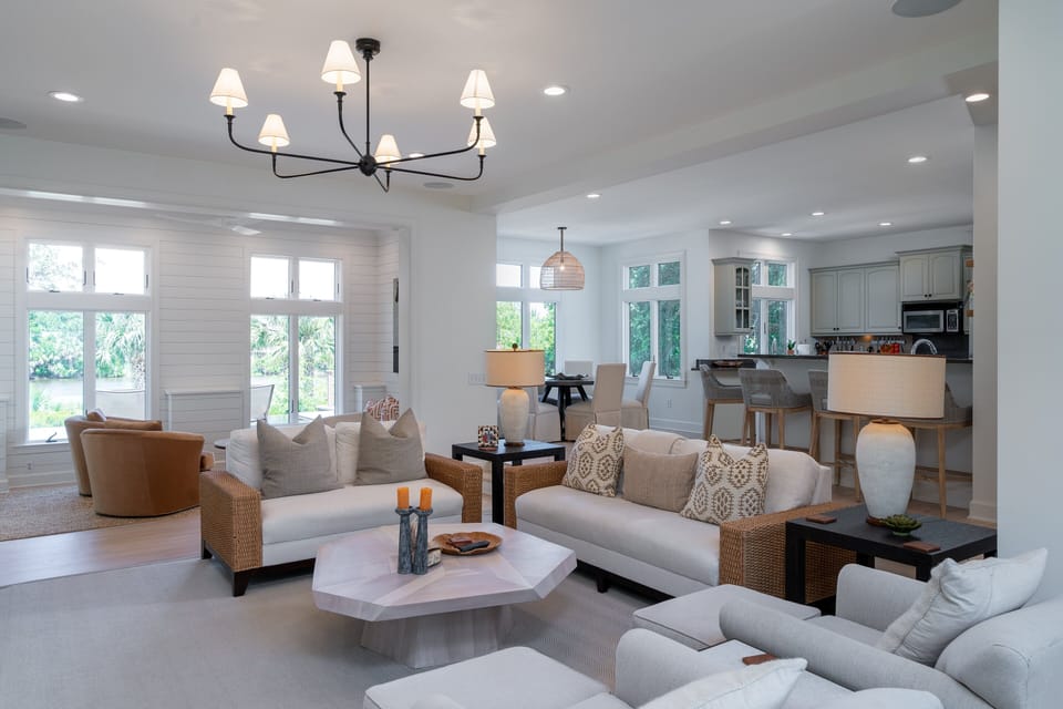 The great room is open to a secondary sitting area, the dining area and the kitchen