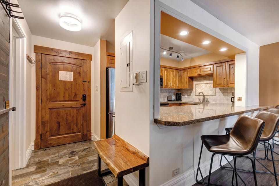 Step into your welcoming mountain retreat where rustic charm meets modern comfort - a fully equipped kitchen awaits your culinary adventures.