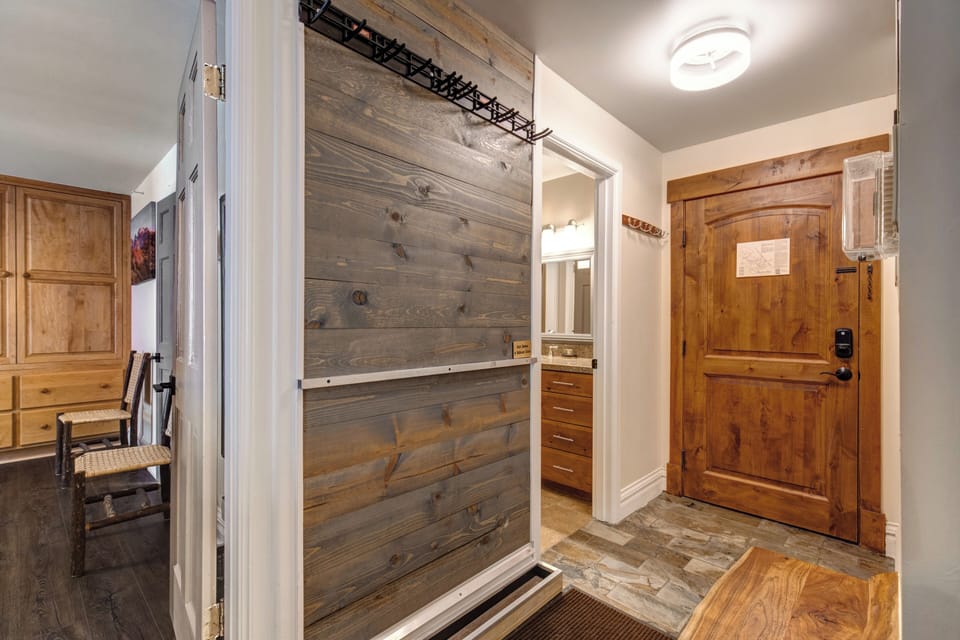 Step into your mountain retreat where rustic wood finishes and cozy touches create the perfect alpine getaway atmosphere.