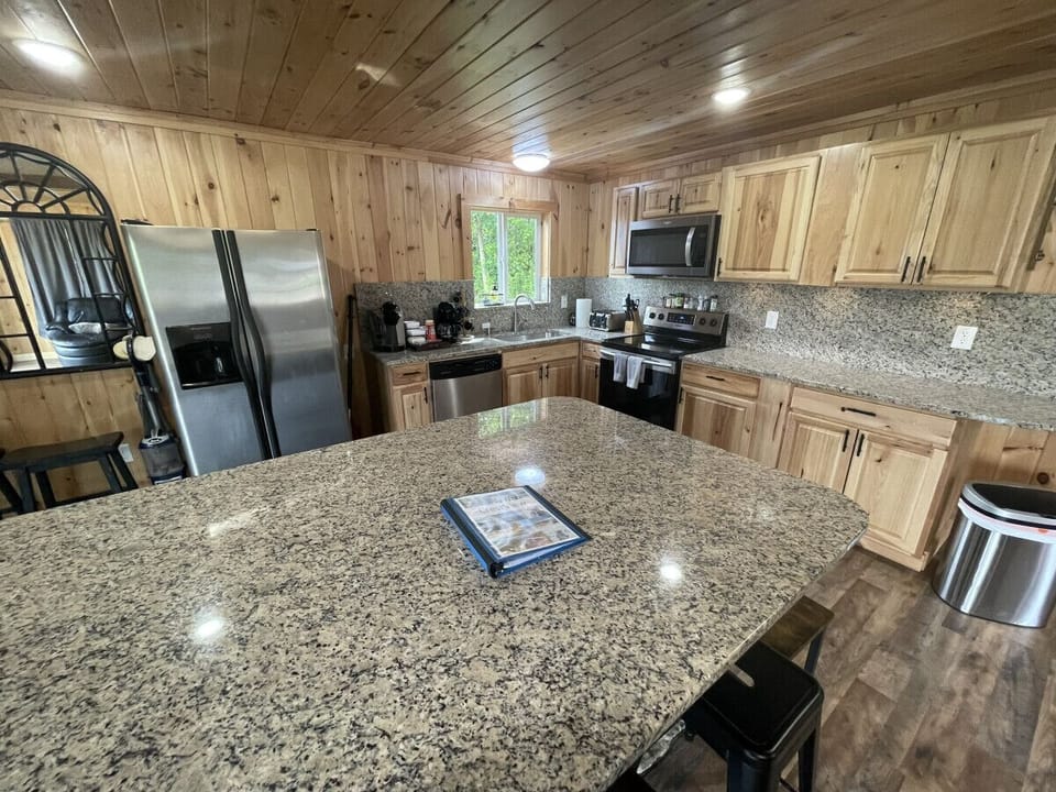 Fully stocked kitchen with Huge Island Great seating for 8