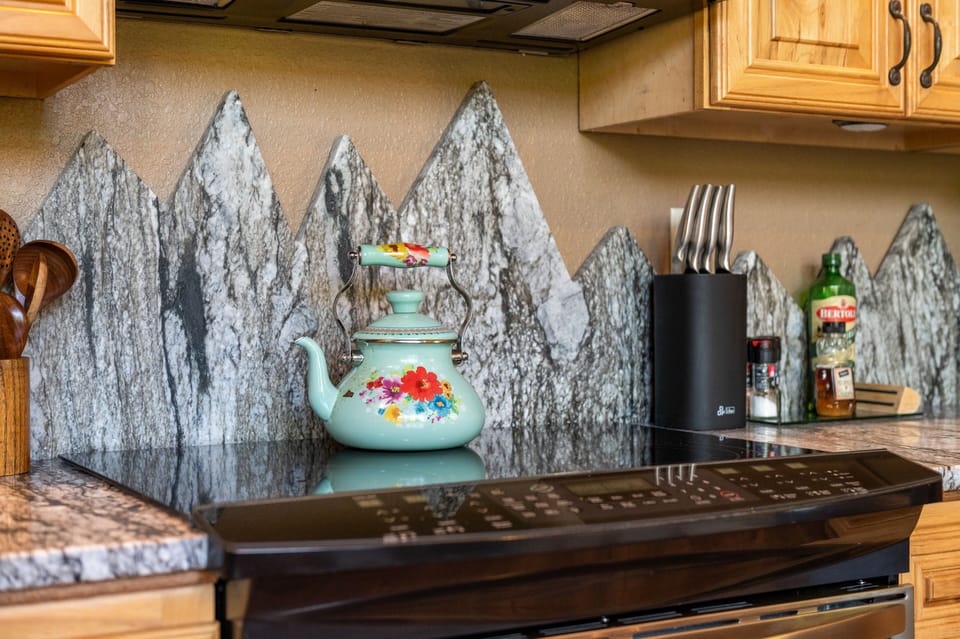Custom mountain stone backsplash in kitchen