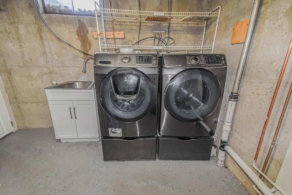 The unit is equipped with convenient laundry facilities, including a washer and dryer, making it easy to keep your clothes fresh and clean throughout your stay.
