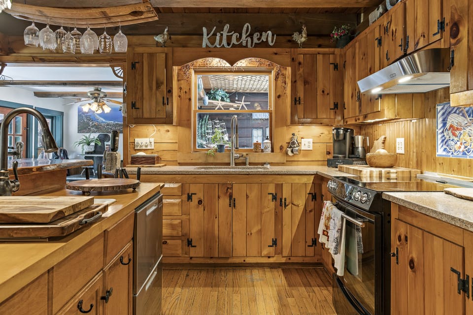 Full kitchen with gas and electric stoves, 2 dishwashers, 2 islands, 3 sinks!