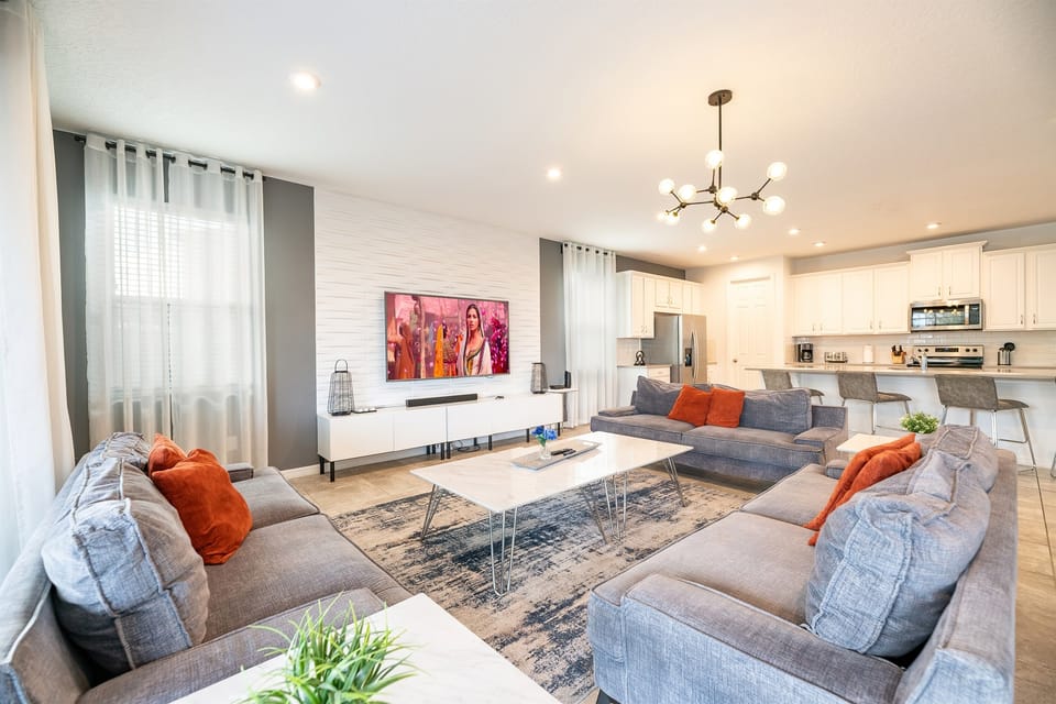 Living Room: Bright and airy space with modern decor, perfect for relaxation and fun gatherings!